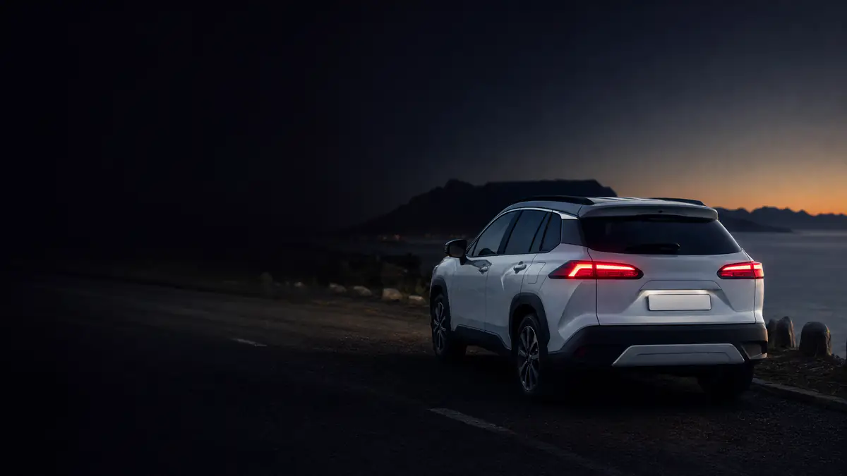 White Toyota Corolla Cross above the Atlantic at blue hour, find your next used car at Cars342