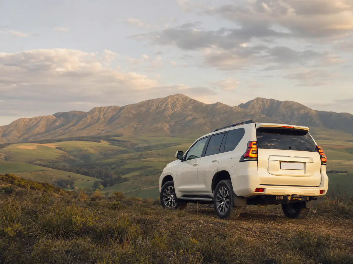 White Toyota Land Cruiser Prado on a Western Cape hilltop, estimate your car instalment at Cars342